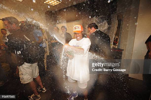 Temeka Johnson of the Phoenix Mercury celebrates with champagne after defeating the Indiana Fever 94-86 in Game five of the WNBA Finals played on...