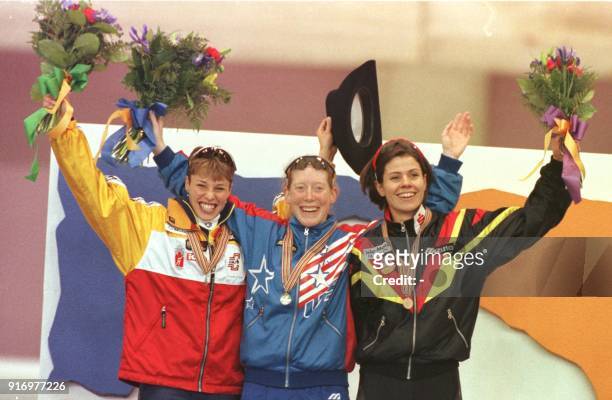 Catriona LeMay-Doan of Canada , silver, Christine Witty of USA , gold, and Franziska Schenk of Germany, bronze, stand on the podium after the1000...
