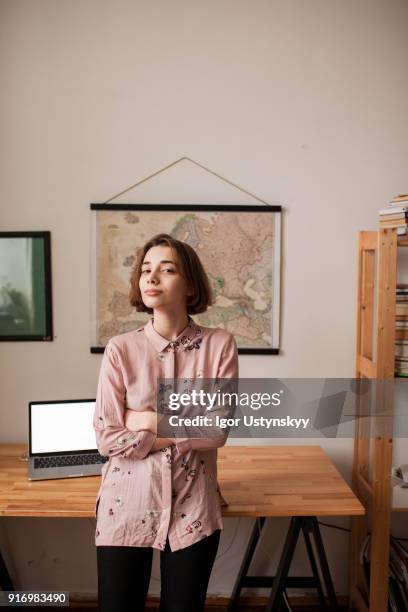 portrait of confident woman standing with hands folded - woman fresh air fotografías e imágenes de stock