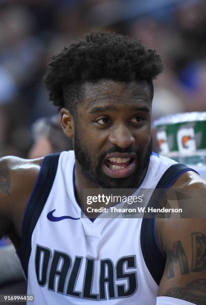 Wesley Matthews of the Dallas Mavericks looks on from the bench against the Golden State Warriors during an NBA basketball game at ORACLE Arena on...