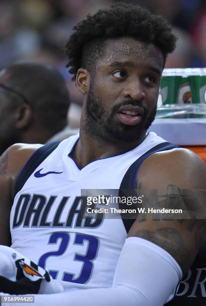 Wesley Matthews of the Dallas Mavericks looks on from the bench against the Golden State Warriors during an NBA basketball game at ORACLE Arena on...