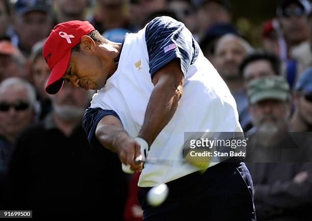 Tiger Woods hits a drive during the second round four-ball matches for The Presidents Cup at Harding Park Golf Club on October 9, 2009 in San...