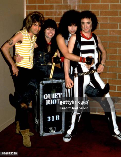 Guitarist Carlos Cavazo, bassist Rudy Sarzo, drummer Frankie Banali and vocalist Kevin DuBrow , of the American heavy metal band Quiet Riot, pose for...