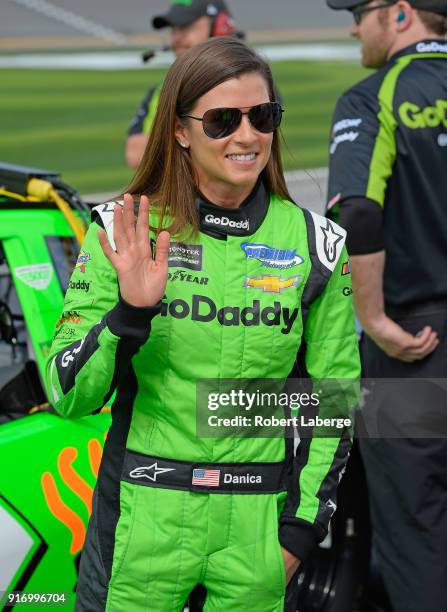 Danica Patrick, driver of the GoDaddy Chevrolet, stands by her car during qualifying for the Monster Energy NASCAR Cup Series Daytona 500 at Daytona...