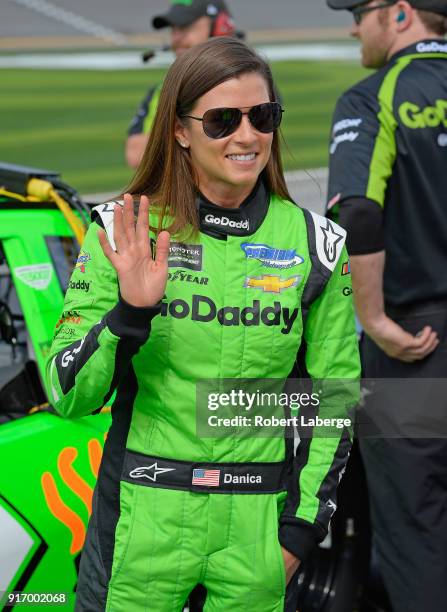 Danica Patrick, driver of the GoDaddy Chevrolet, stands by her car during qualifying for the Monster Energy NASCAR Cup Series Daytona 500 at Daytona...