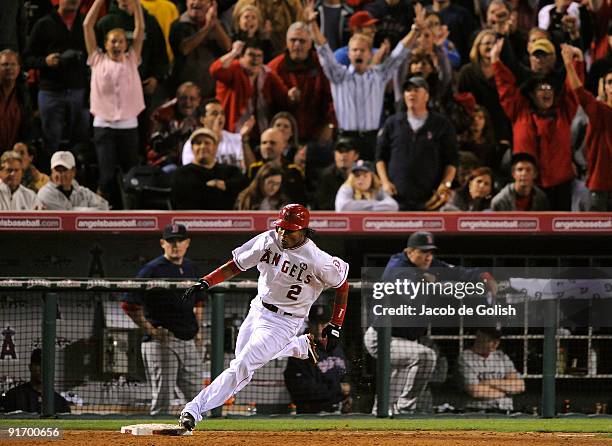 Erick Aybar of the Los Angeles Angels of Anaheim runs the bases after hiiting a RBI triple base against the Boston Red Sox in Game Two of the ALDS...