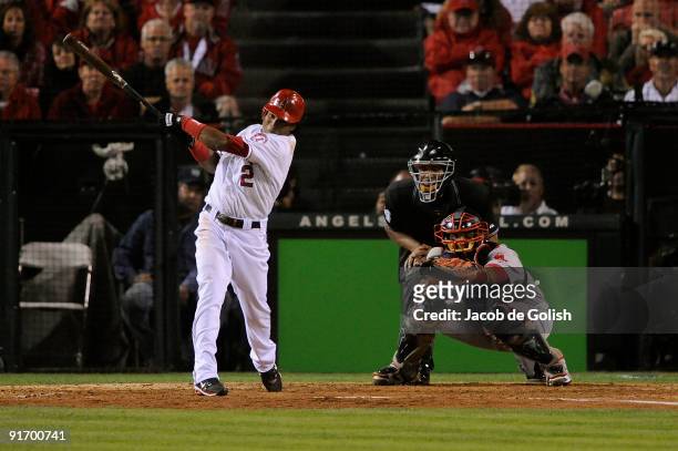 Erick Aybar of the Los Angeles Angels of Anaheim hits a RBI triple base against the Boston Red Sox in Game Two of the ALDS during the 2009 MLB...