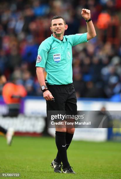 Referee Michael Oliver during the Premier League match between Huddersfield Town and AFC Bournemouth at John Smith's Stadium on February 11, 2018 in...