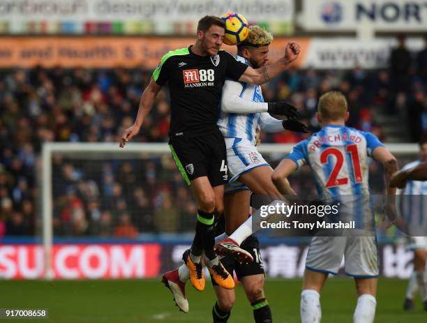 Philip Billing of Huddersfield Town challenegs Dan Gosling of AFC Bournemouth in the air during the Premier League match between Huddersfield Town...