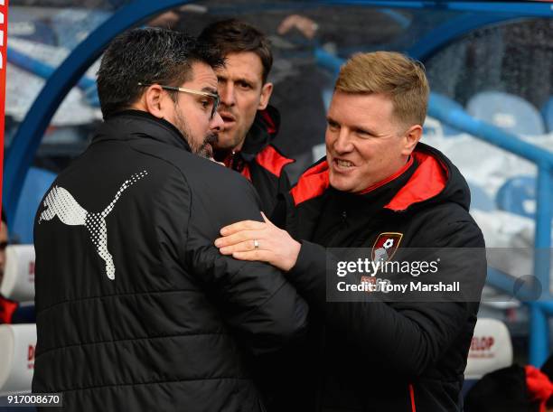 David Wagner, Manager of Huddersfield Town embraces Eddie Howe, Manager of AFC Bournemouth before the Premier League match between Huddersfield Town...