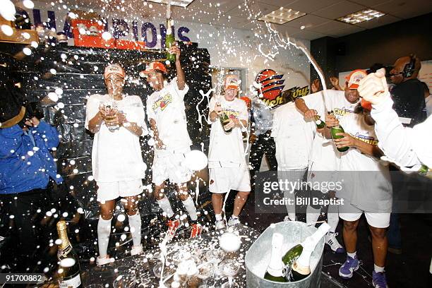 DeWanna Bonner and Penny Taylor of the Phoenix Mercury celebrates after defeating the Indiana Fever during Game Five of the WNBA Finals on October 9,...