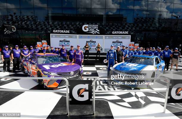 Denny Hamlin, driver of the FedEx Express Toyota, and Alex Bowman, driver of the Nationwide Chevrolet, pose for a photo after winning the pole award...