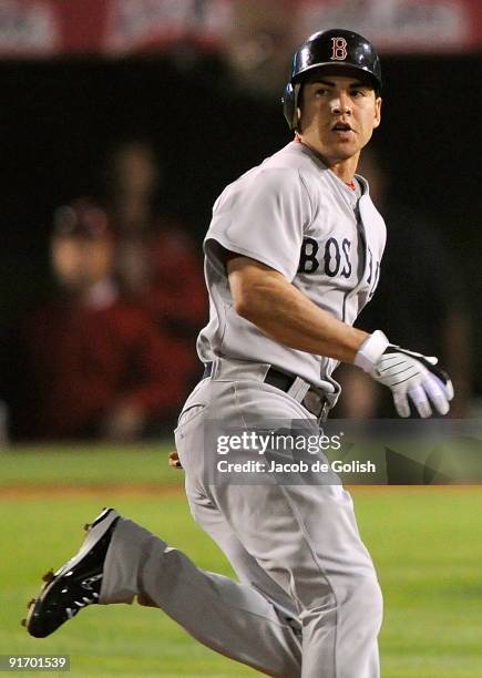 Jacoby Ellsbury of the Boston Red Sox rounds the bases after hitting a triple in the fourth inning of Game Two of the ALDS against the Los Angeles...