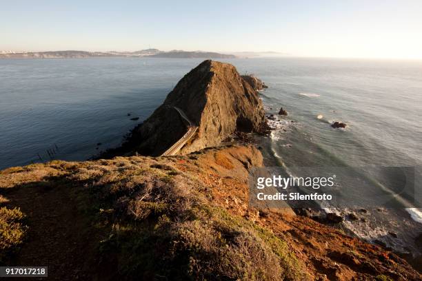 from the trail looking down upon point bonita and the lighthouse, north of the golden gate. - marin headlands fotografías e imágenes de stock
