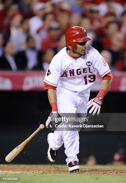 Maicer Izturis of the Los Angeles Angels of Anaheim hits an RBI single in the seventh inning against the Boston Red Sox in Game Two of the ALDS...