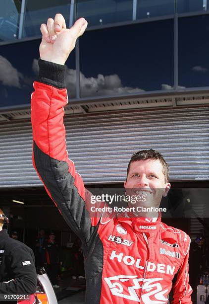 Garth Tander driver of Holden Racing Team Holden celebrates his qualification, with teammate Will Davison for pole position for the Bathurst 1000,...