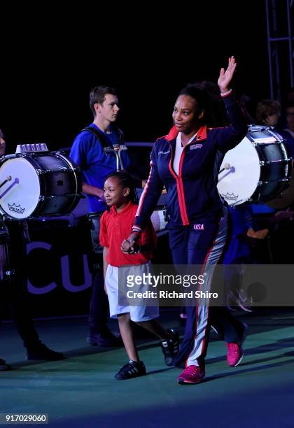 Venus Williams of Team USA and child volunteer enter the court before the first round of the 2018 Fed Cup at US Cellular Center on February 11, 2018...