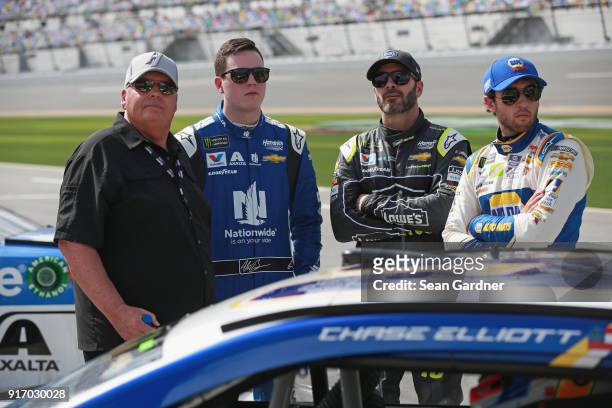 Team owner, Rick Hendrick, stands with Alex Bowman, driver of the Nationwide Chevrolet, Jimmie Johnson, driver of the Lowe's for Pros Chevrolet, and...