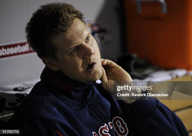 Pitcher Jonathan Papelbon of the Boston Red Sox watches the Los Angeles Angels of Anaheim celebrate their 4-1 win of Game Two during the ALDS in the...