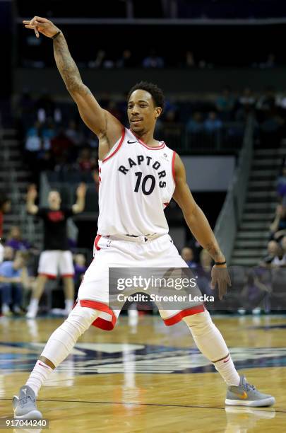 DeMar DeRozan of the Toronto Raptors reacts after a shot against the Charlotte Hornets during their game at Spectrum Center on February 11, 2018 in...