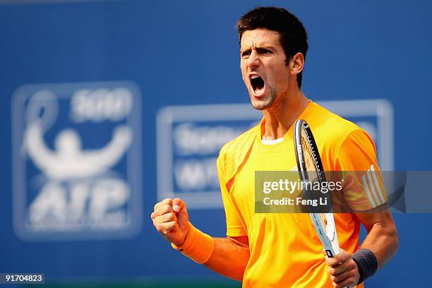 Novak Djokovic of Serbia celebrates a shot against Robin Soderling of Sweden in the Semifinals during day nine of the 2009 China Open at the National...