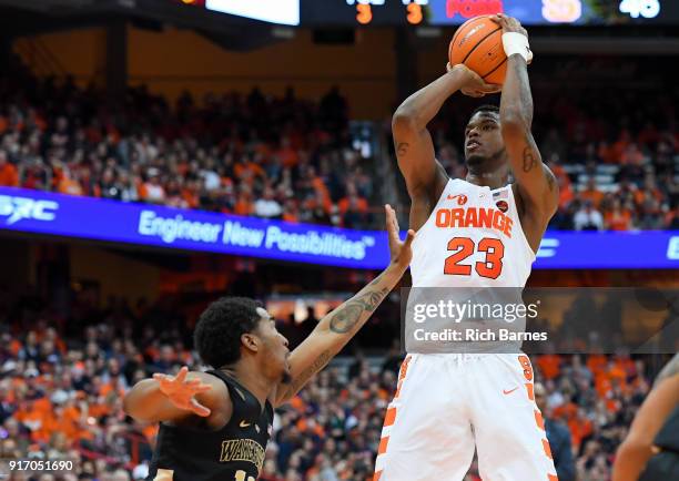 Frank Howard of the Syracuse Orange shoots the ball over Bryant Crawford of the Wake Forest Demon Deacons during the second half at the Carrier Dome...