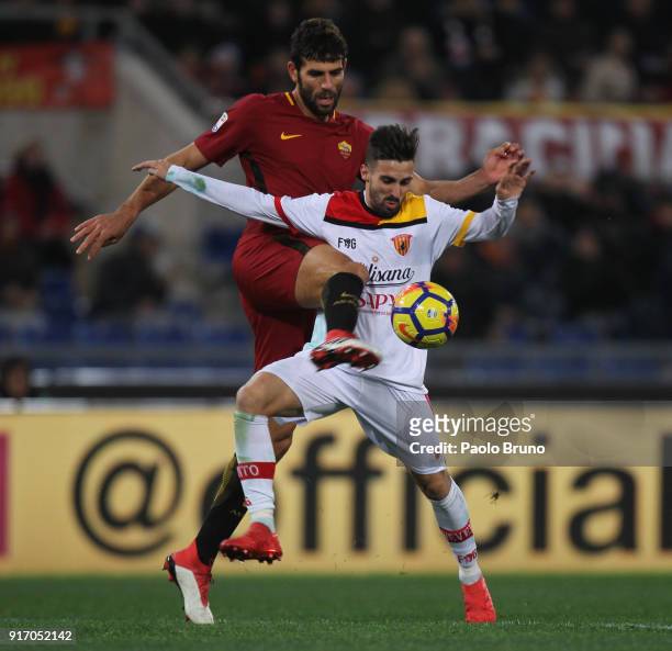 Marco D'Alessandro of Benevento Calcio competes for the ball with Federico Fazio of AS Roma during the serie A match between AS Roma and Benevento...