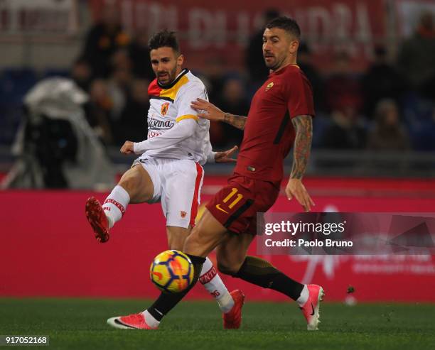 Marco D'Alessandro of Benevento Calcio competes for the ball with Aleksandar Kolarov of AS Roma during the serie A match between AS Roma and...