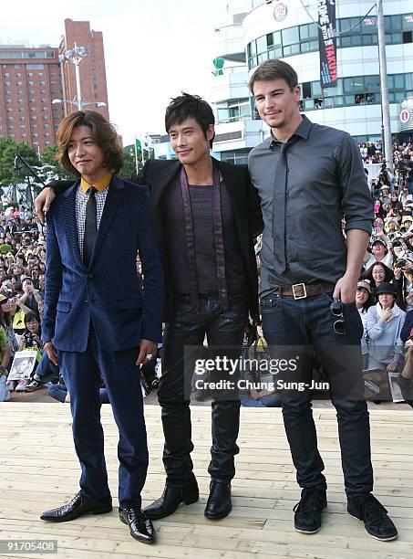 Actor Takuya Kimura, Lee Byung-Hun and Josh Hartnett attend the open talk 'I Come with the Rain' during the 14th Pusan International Film Festival at...