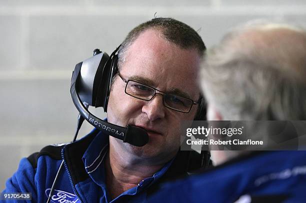 Tim Edwards team principal for Ford Performance Racing talks to Dave Richards owner of Pro Drive during qualifying for the Bathurst 1000, which is...