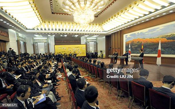 Chinese Premier Wen Jiabao , Japanese Prime Minister Yukio Hatoyama and South Korean President Lee Myung-Bak attend at a joint press conference of...