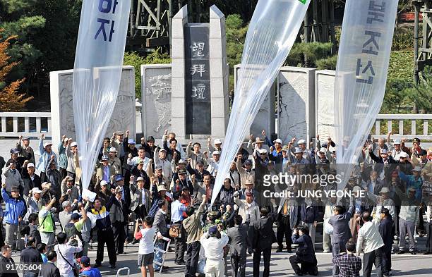 South Korean conservative activists launch large balloons carrying anti-Pyongyang leaflets and radios, at Imjingak peace park in Paju near the...