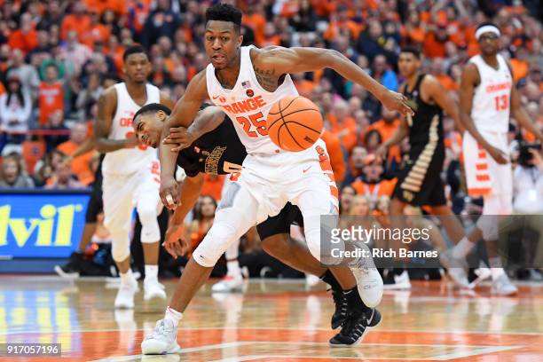 Tyus Battle of the Syracuse Orange and Brandon Childress of the Wake Forest Demon Deacons battle for control of the ball during the second half at...