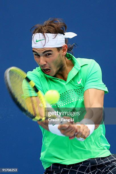 Rafael Nadal of Spain returns a shot against Marin Cilic of Croatia in the Semifinals during day nine of the 2009 China Open at the National Tennis...