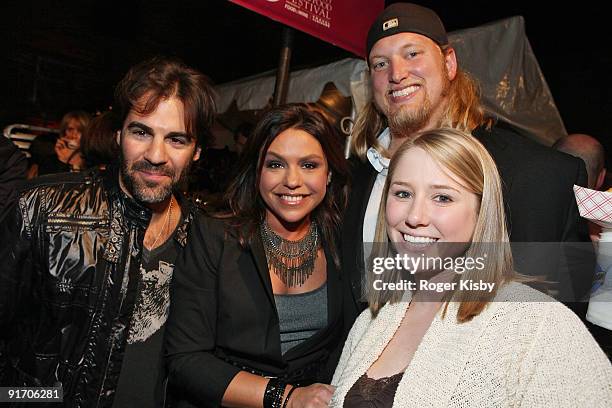 Musician John Cusimano, chef Rachael Ray, New York Jets center Nick Mangold and wife Jennifer Richmond attend the Burger Bash at the Tobacco...