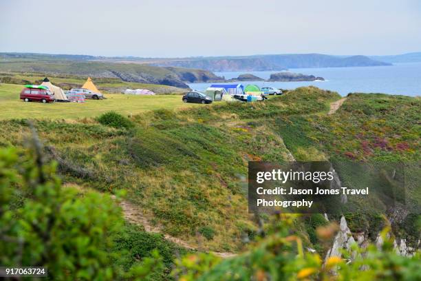 campsite overlooking coast - pembroke stock pictures, royalty-free photos & images