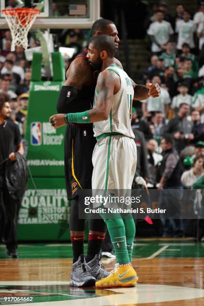 Kyrie Irving of the Boston Celtics greets LeBron James of the Cleveland Cavaliers before the game on February 11, 2018 at TD Garden in Boston,...