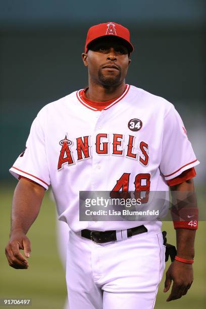 Torii Hunter of the Los Angeles Angels of Anaheim walks on to the field to start Game Two of the ALDS against the Red Sox during the 2009 MLB...