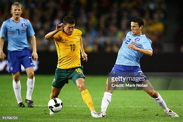 Harry Kewell of the Socceroos and Khalid Boulahrouz of the Netherlands contest possession during the International friendly football match between...