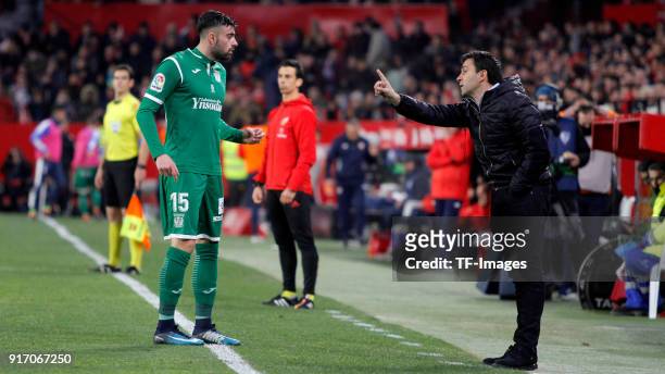 Diego Rico of Leganes speaks with Head coach Asier Garitano of Leganes during the Copa del Rey semi-final second leg match between Sevilla FC and CD...