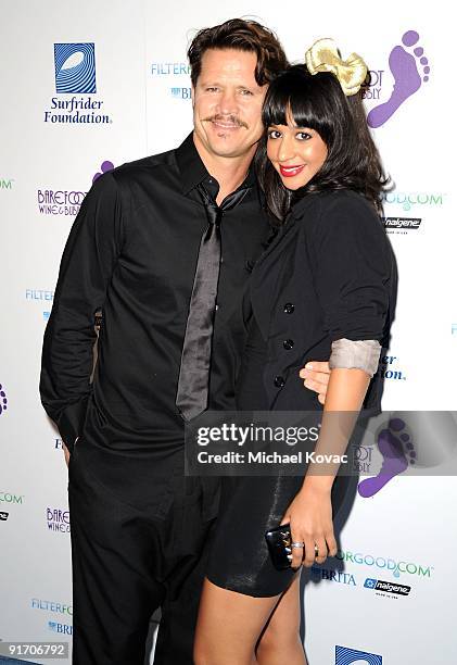 Surfer Brad Gerlach and guest arrive at The Surfrider Foundation's 25th Anniversary Gala at California Science Center's Wallis Annenberg Building on...