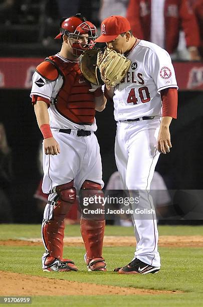 Catcher Mike Napoli and pitcher Brian Fuentes of the Los Angeles Angels of Anaheim talk near the mound in Game Two of the ALDS against the Boston Red...