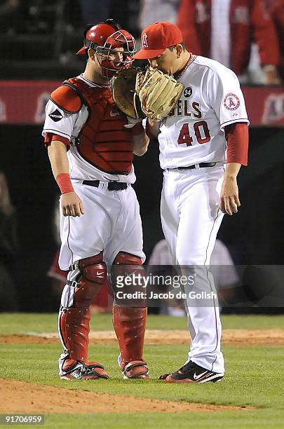Catcher Mike Napoli and pitcher Brian Fuentes of the Los Angeles Angels of Anaheim talk near the mound in Game Two of the ALDS against the Boston Red...