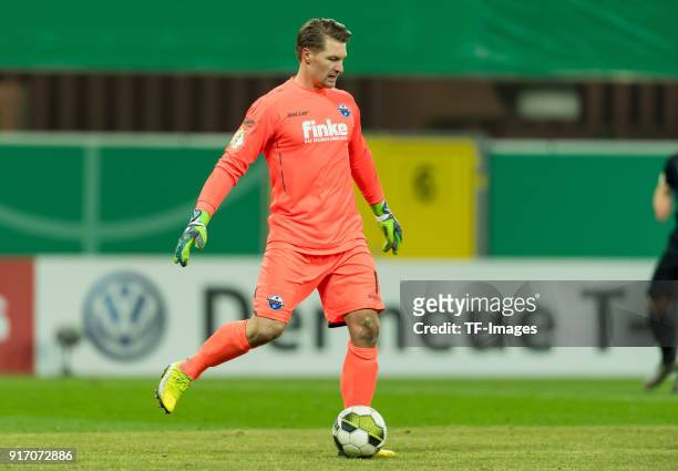 Goalkeeper Michael Ratajczak of Paderborn controls the ball during the DFB Cup match between SC Paderborn and Bayern Muenchen at Benteler Arena on...