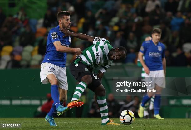 Sporting CP forward Seydou Doumbia from Ivory Coast with CD Feirense forward Luis Aurelio from Portugal in action during the Primeira Liga match...