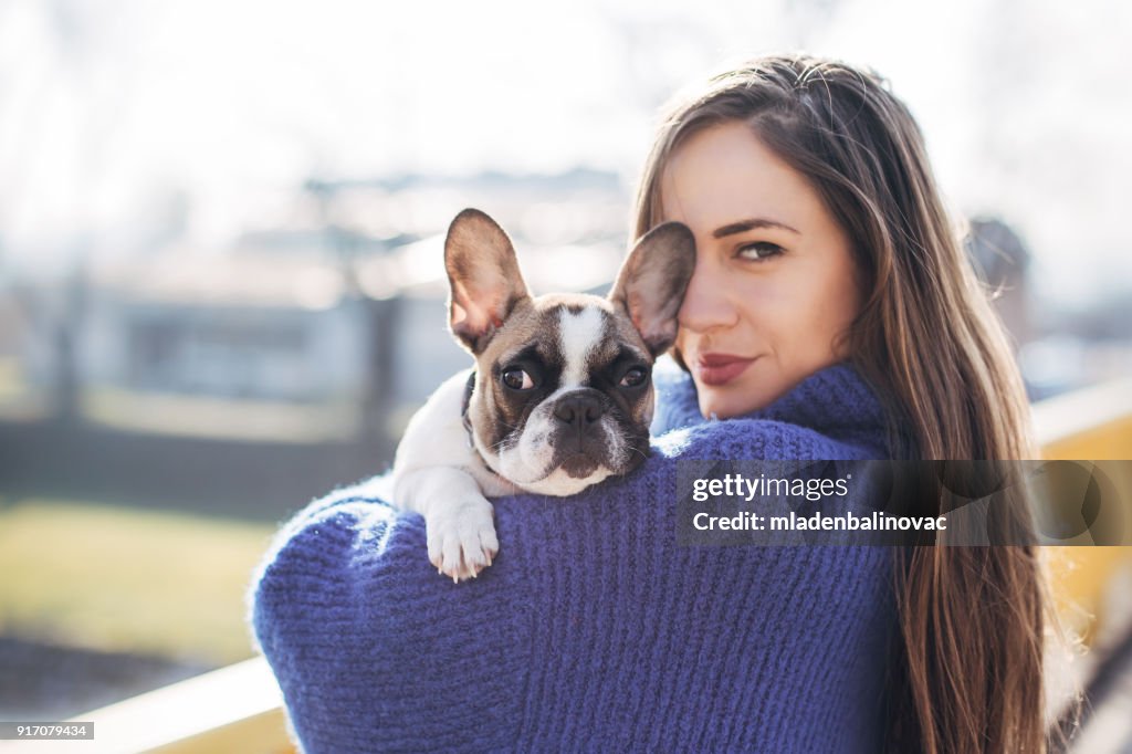 Woman and French bulldog