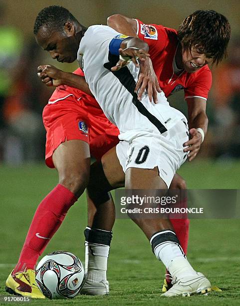 South Korea's defender Hong Jeong Ho vies for the ball with Ghana's midfielder Andre Ayew during their FIFA Under-20 World Cup quarter-final football...