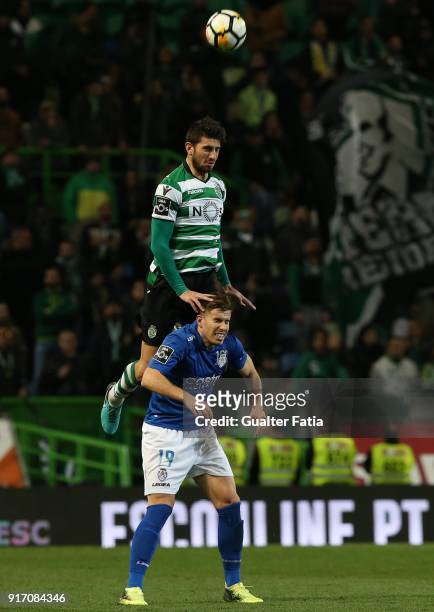 Sporting CP defender Cristiano Piccini from Italy with CD Feirense forward Joao Silva from Portugal in action during the Primeira Liga match between...