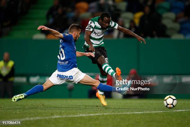 Sporting's forward Seydou Doumbia vies for the ball with Feirense's midfielder Luis Aurelio during Primeira Liga 2017/18 match between Sporting CP vs...