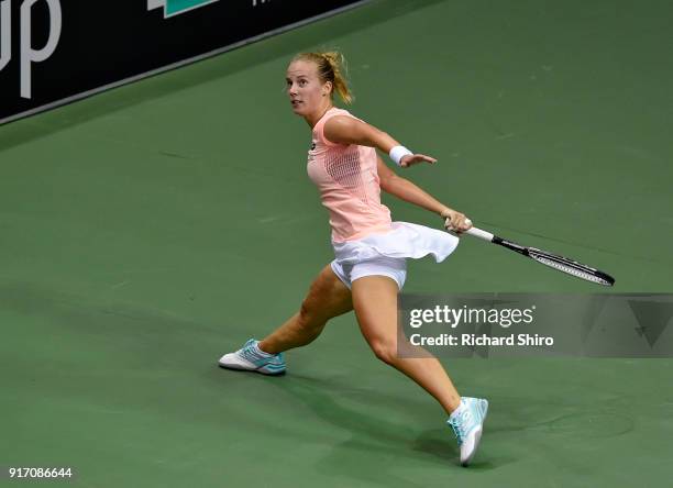 Richel Hogenkamp of the Netherlands returns a shot by Venus Williams of Team USA and during the first round of the 2018 Fed Cup at US Cellular Center...